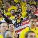 A Michigan fan cheers while holding an American flag before the start of the first half against Indiana at Crisler Center on Sunday, March 10, 2013. Melanie Maxwell I AnnArbor.com
